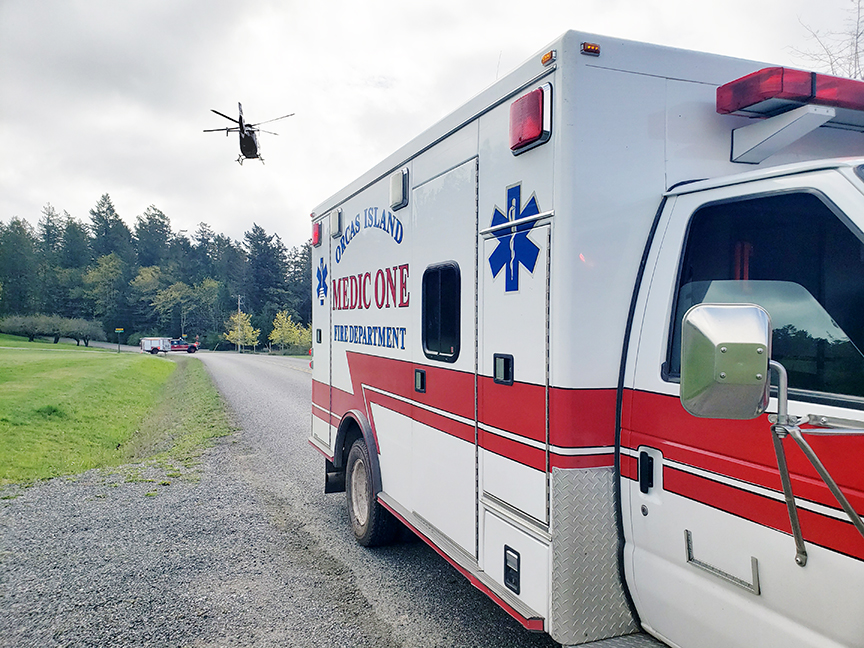 A patient transfer to Airlift Northwest at the Deer Harbor landing zone.  OIFR Photo